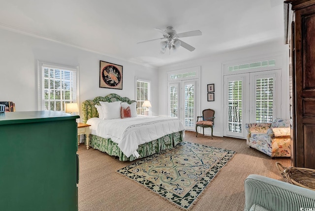 carpeted bedroom featuring ornamental molding, ceiling fan, and access to outside