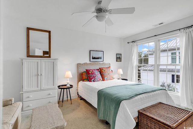 bedroom featuring ceiling fan and light colored carpet