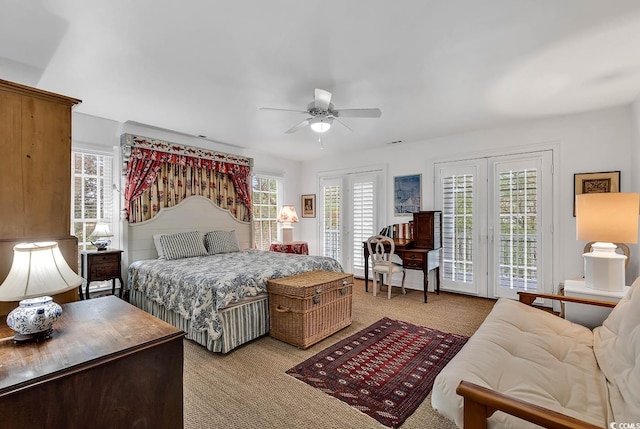 carpeted bedroom featuring ceiling fan and access to outside