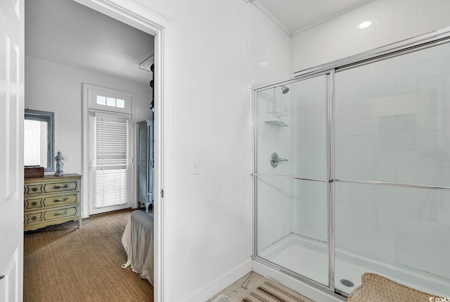 bathroom featuring a shower with shower door