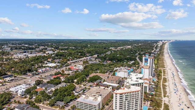 bird's eye view featuring a water view and a view of the beach