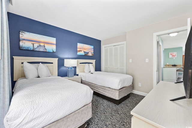 carpeted bedroom with a closet