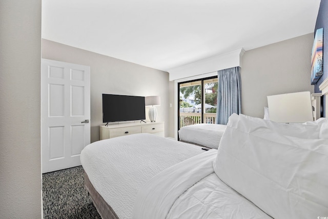 bedroom featuring access to outside and carpet flooring