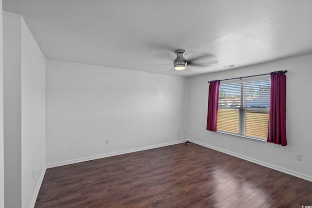 unfurnished room featuring dark hardwood / wood-style floors and ceiling fan