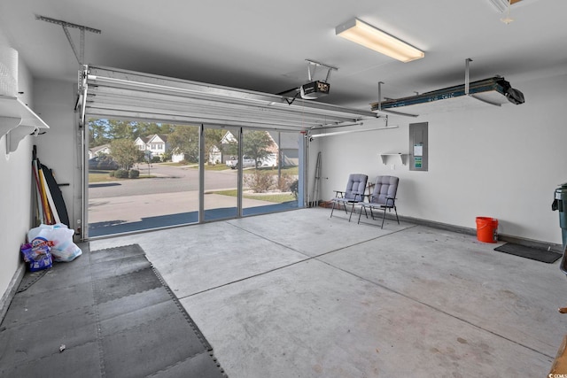 garage with a garage door opener and electric panel