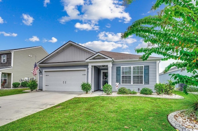 view of front of house featuring a front yard and a garage