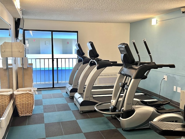 workout area with a textured ceiling