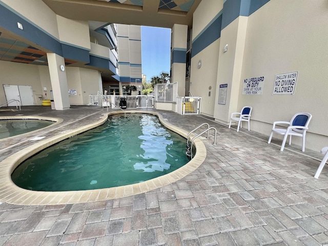 view of pool with a patio