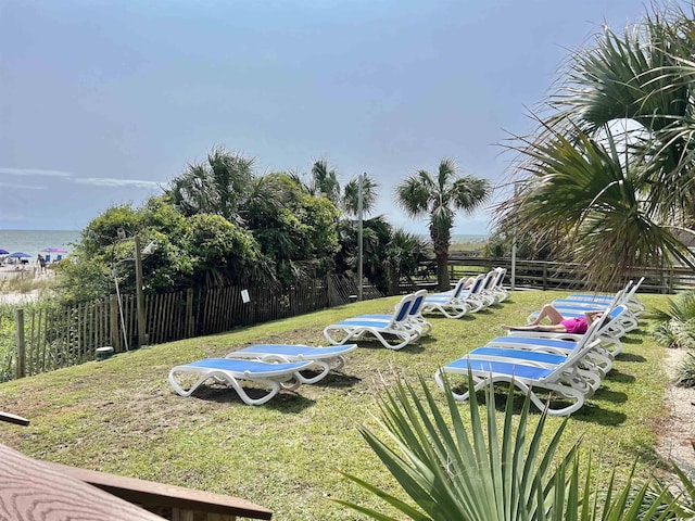 exterior space featuring a yard and a water view