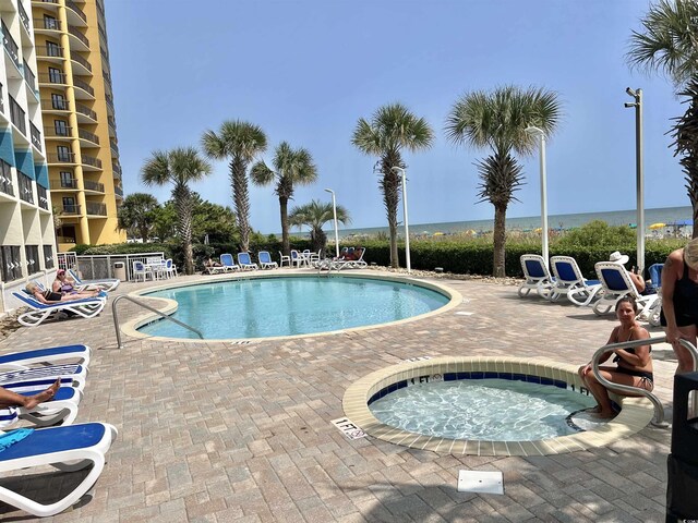 2504 N Ocean Blvd Unit 734, Myrtle Beach, SC 29577 - community pool with a patio area and a community hot tub
