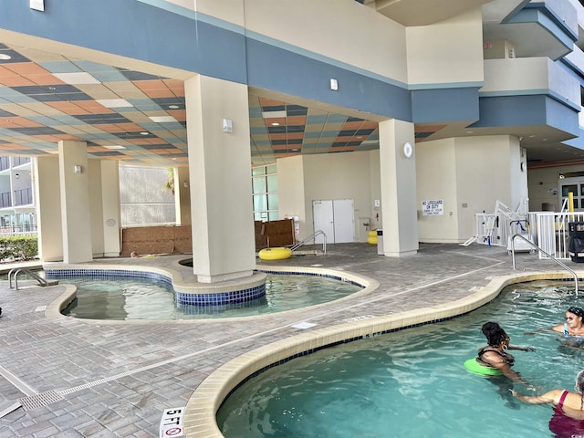 view of swimming pool featuring a patio area