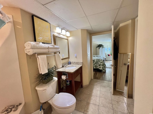 2504 N Ocean Blvd Unit 734, Myrtle Beach, SC 29577 - bathroom with connected bathroom, vanity, tile patterned floors, and a paneled ceiling