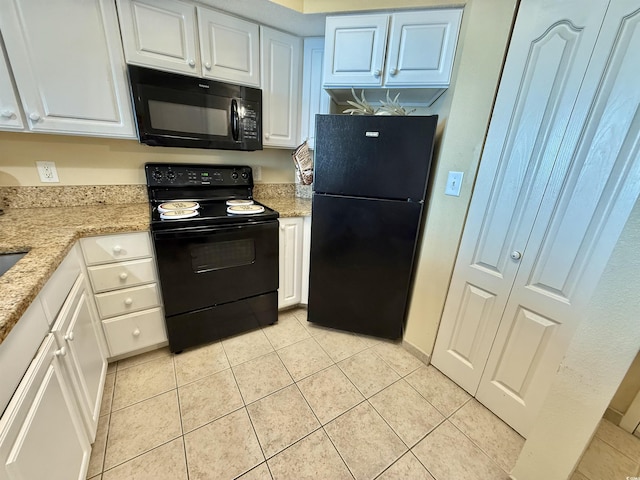 2504 N Ocean Blvd Unit 734, Myrtle Beach, SC 29577 - kitchen with black appliances, light tile patterned floors, white cabinets, and light stone countertops