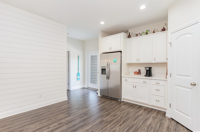 kitchen featuring white cabinetry, stainless steel refrigerator with ice dispenser, and dark hardwood / wood-style floors