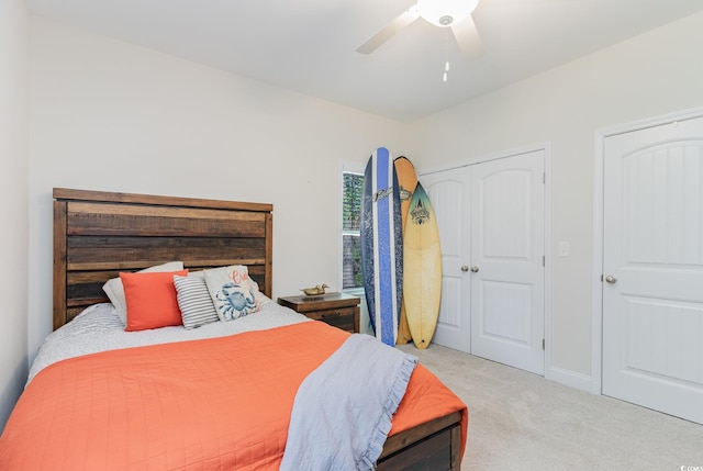 carpeted bedroom featuring ceiling fan