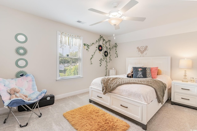 bedroom with light carpet and ceiling fan