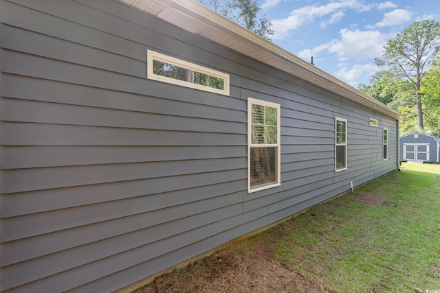 view of side of home featuring a lawn