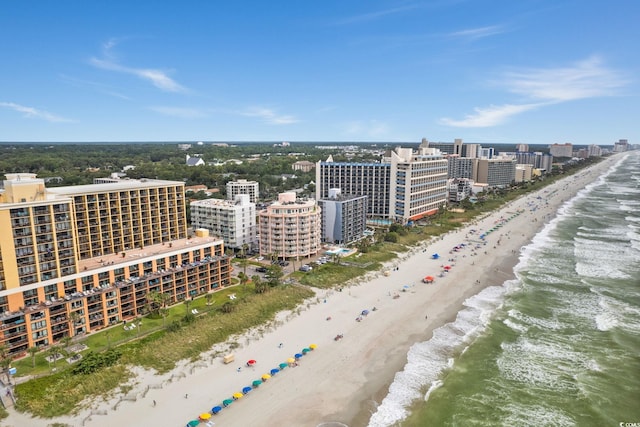 drone / aerial view featuring a view of the beach and a water view