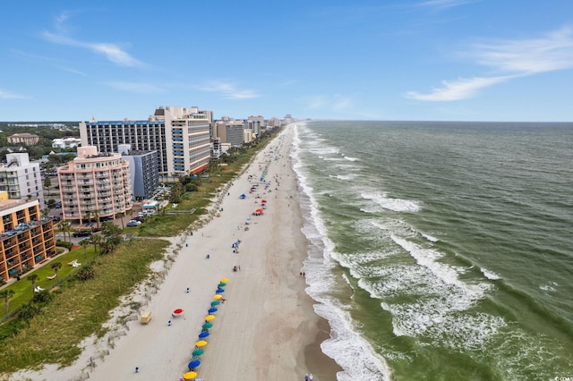 aerial view with a water view and a beach view