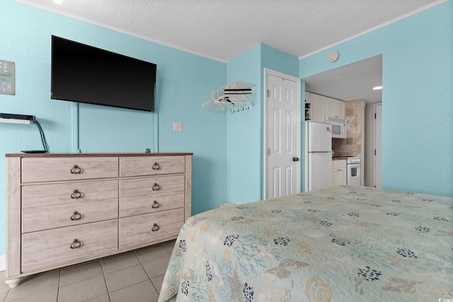 tiled bedroom featuring ornamental molding, a closet, a textured ceiling, and white fridge