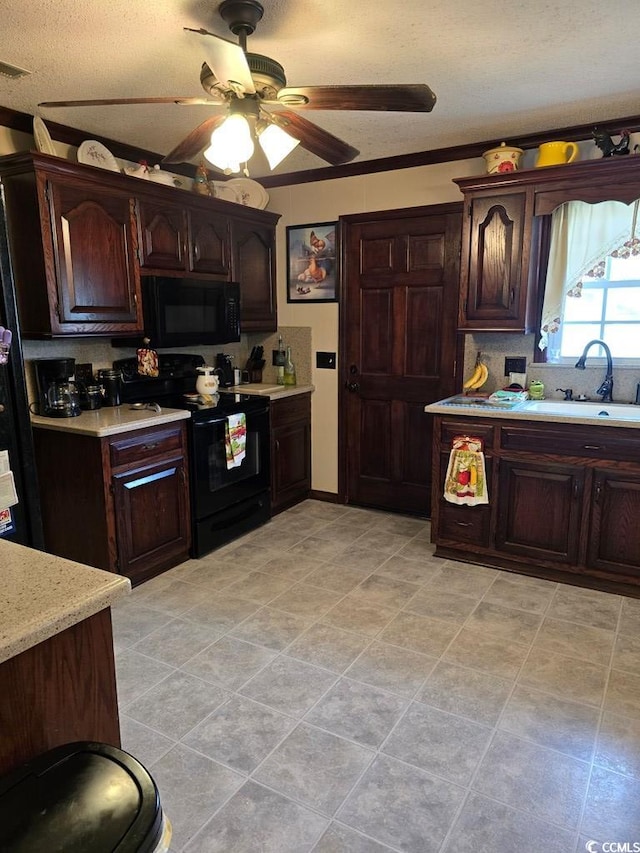 kitchen featuring tasteful backsplash, sink, black appliances, dark brown cabinetry, and ceiling fan