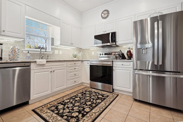 kitchen featuring white cabinetry, sink, and appliances with stainless steel finishes