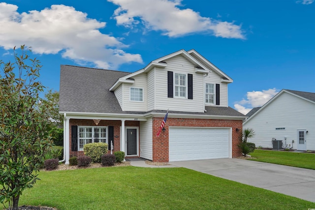 view of front property featuring central AC, a front yard, and a garage