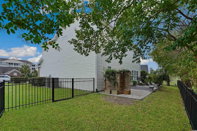 view of property exterior with a patio and a lawn