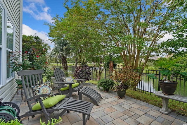 view of patio featuring a water view