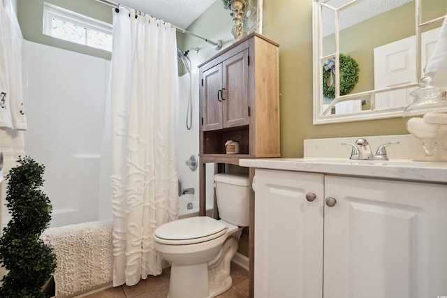 full bathroom featuring vanity, toilet, shower / bath combo, tile patterned floors, and a textured ceiling