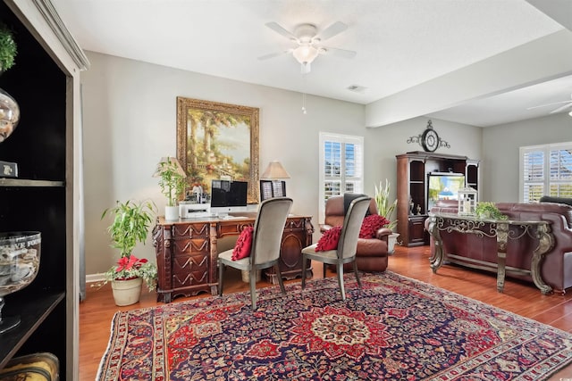 office area with hardwood / wood-style flooring and ceiling fan