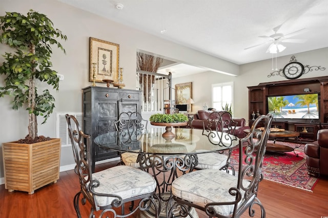 dining area featuring hardwood / wood-style floors and ceiling fan