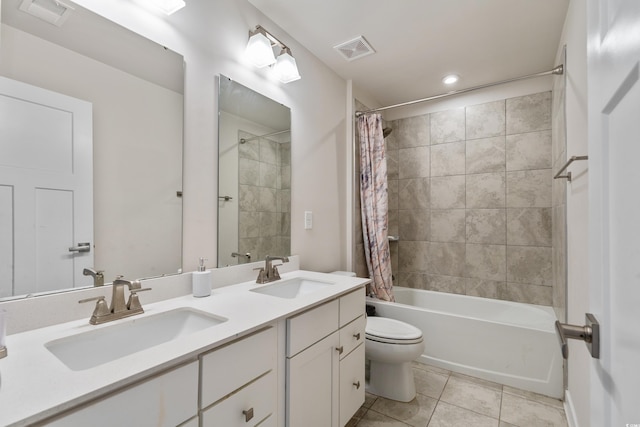 full bathroom with vanity, shower / bath combo with shower curtain, tile patterned flooring, and toilet