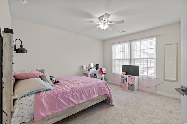 bedroom with light carpet and ceiling fan