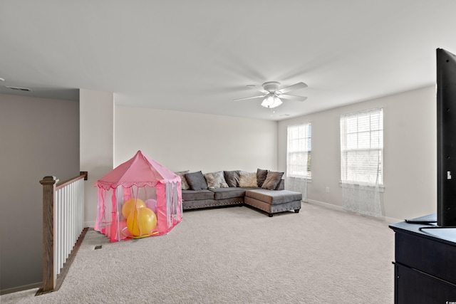 living room with carpet flooring and ceiling fan