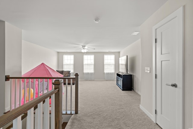 hallway featuring carpet