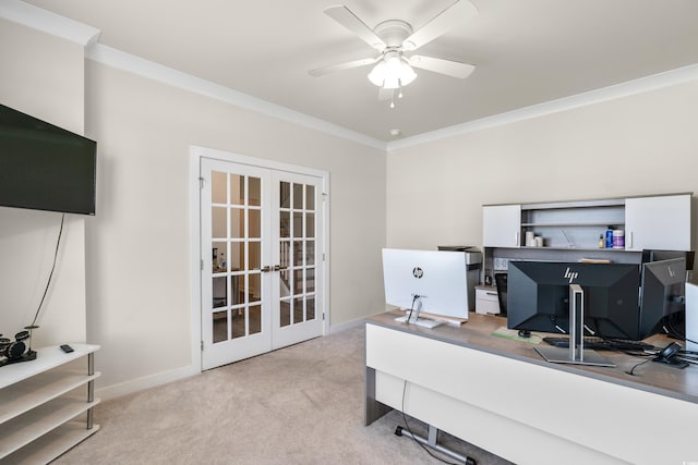 carpeted home office with ceiling fan, french doors, and ornamental molding