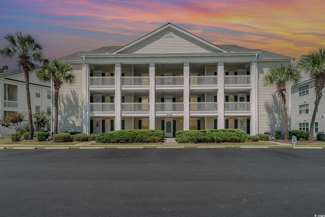 view of outdoor building at dusk