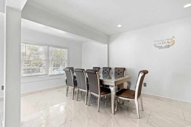 dining space featuring a textured ceiling and ornamental molding