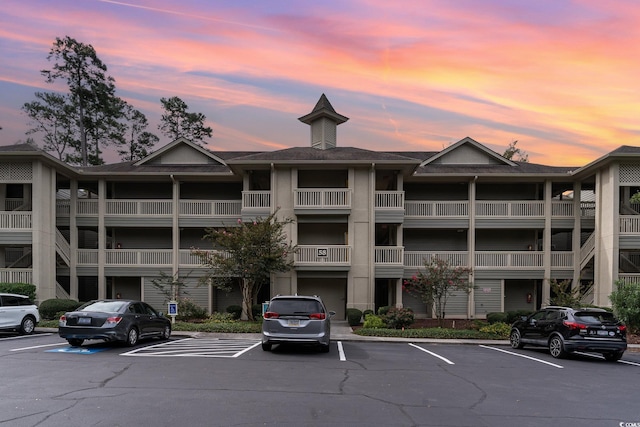 view of outdoor building at dusk