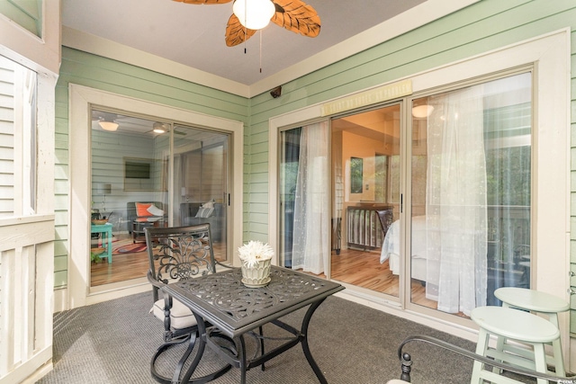 sunroom / solarium with ceiling fan