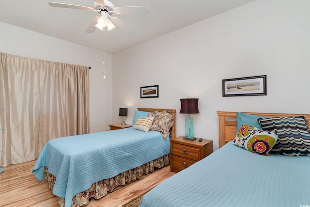 bedroom featuring hardwood / wood-style flooring and ceiling fan