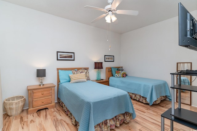 bedroom featuring ceiling fan and light hardwood / wood-style floors