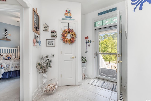 entrance foyer with light tile patterned floors