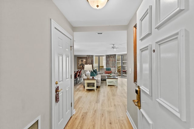 hallway featuring light hardwood / wood-style flooring