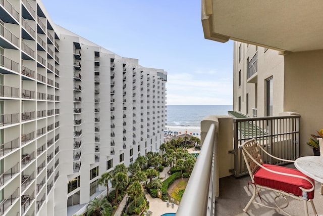 balcony with a beach view and a water view