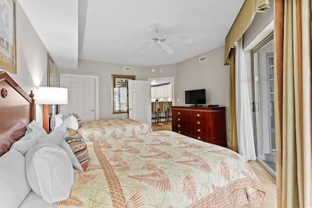 bedroom with light wood-type flooring and ceiling fan