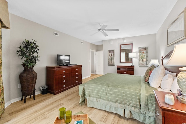 bedroom with light wood-type flooring and ceiling fan