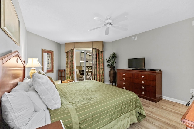 bedroom featuring light wood-type flooring and ceiling fan