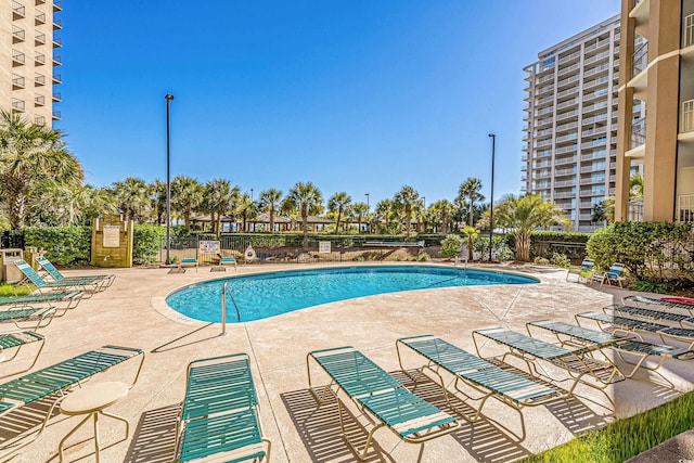 view of swimming pool featuring a patio area